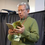 Luis Francia, reading from his book of poetry.
